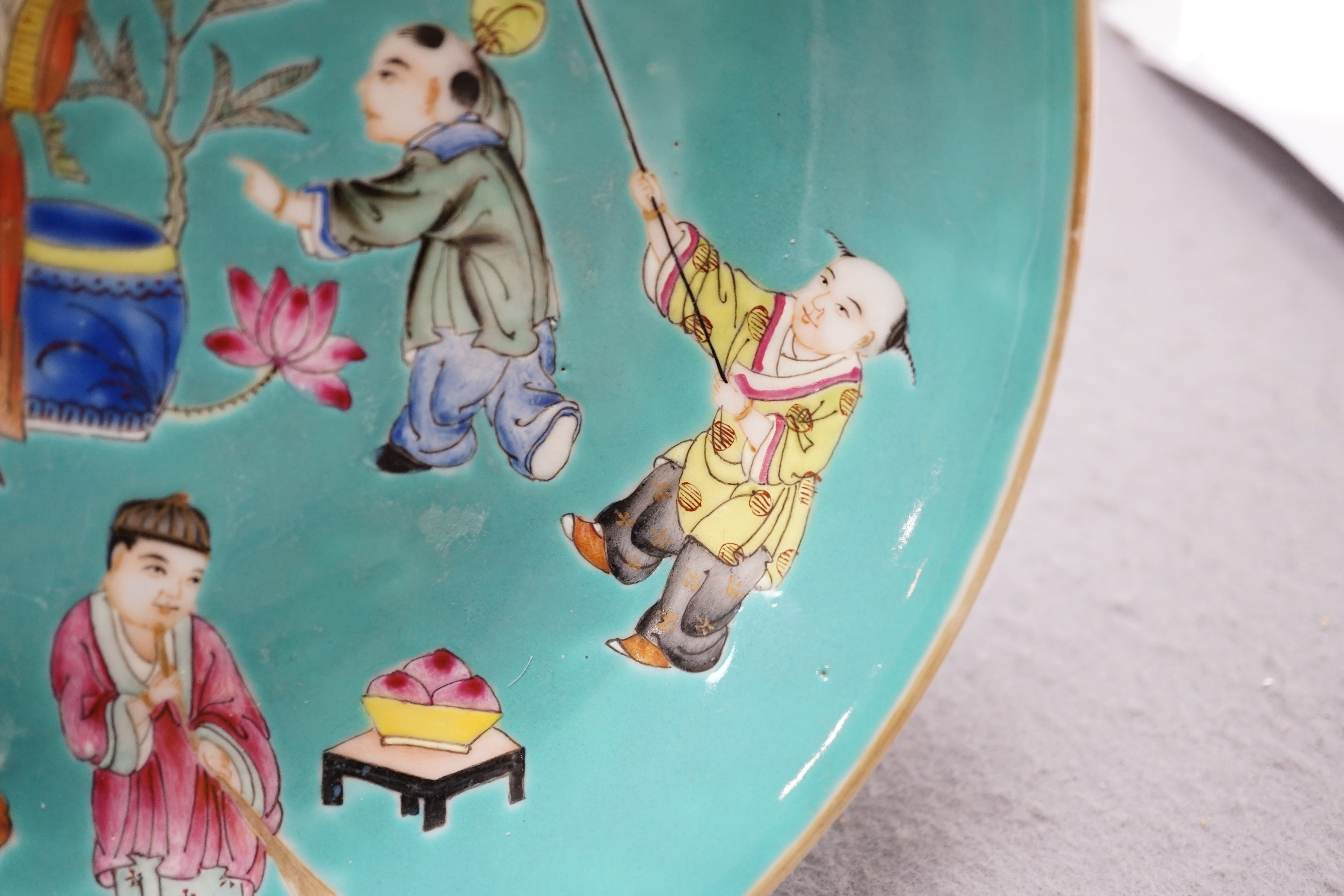 A Chinese turquoise ground 'Boys' dish, Jiaqing seal mark but Republic period, 23.5cm diameter, two hairline cracks